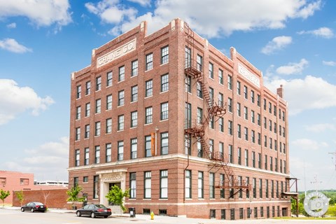 A large red brick building with the words "CRAFTSMAN CO" on the top.